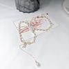 Elegant White Pearl Necklace with Bow Design and Spacer Beads