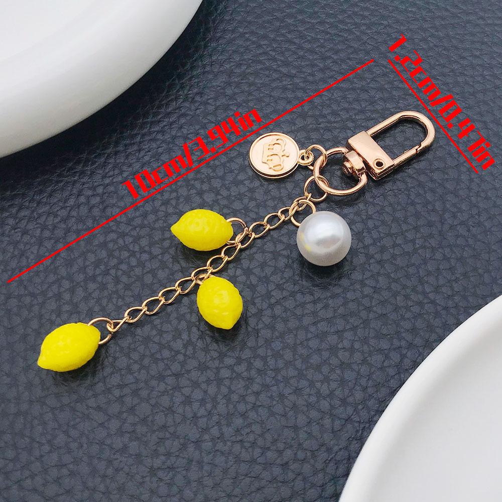 Korean Style Resin Fruit Keychain: Strawberry, Cherry, Apple, Pearl - Creative Earphone Case & Backpack Charm.