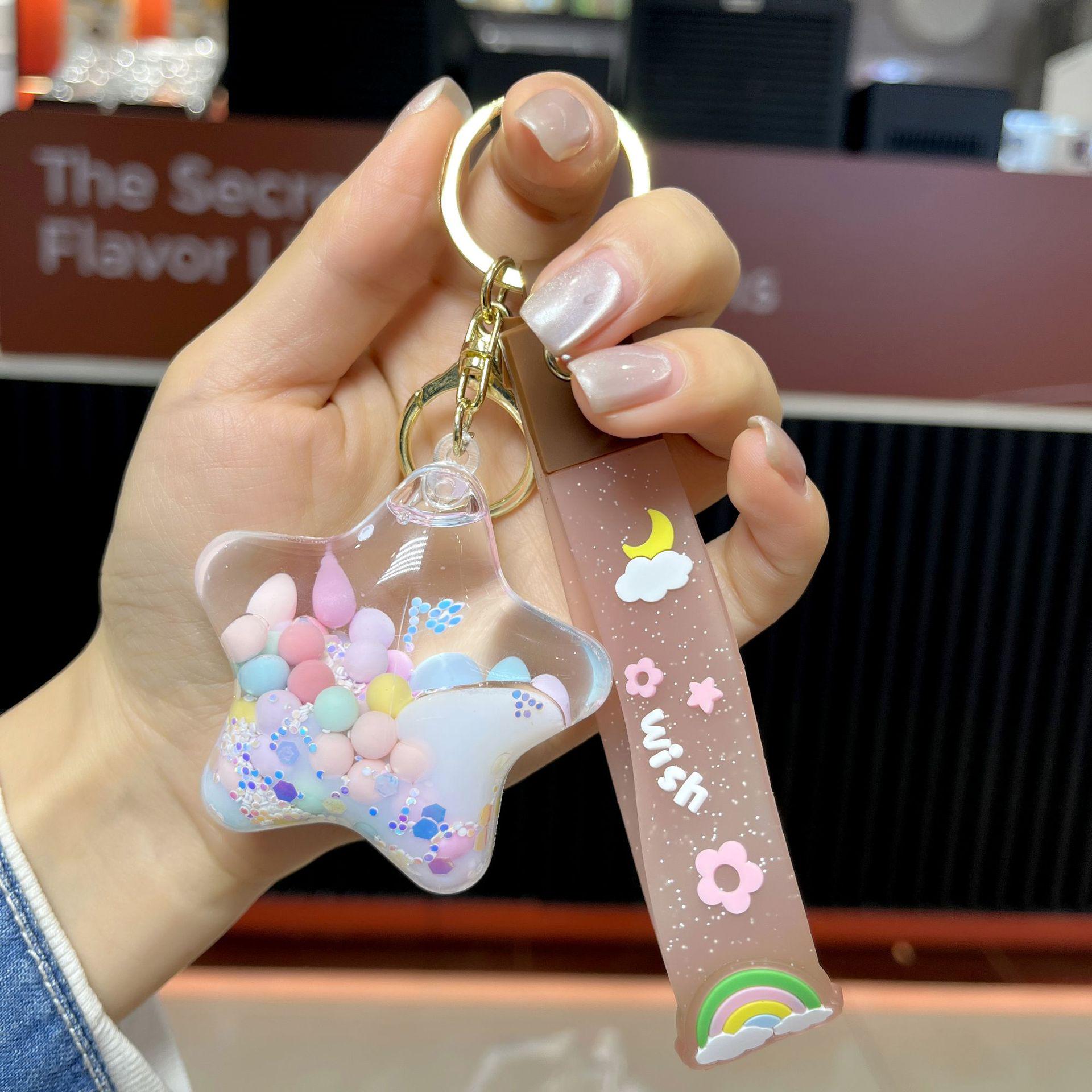 

Подвеска-брелок в виде звезды из акриловых желейных бобов с масляным наполнением в виде зыбучего песка звезда/фиолетовый