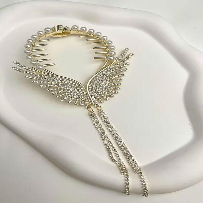 

Senmasy Пряжка-булочка в форме крыльев золотого цвета с камнями и жемчугом