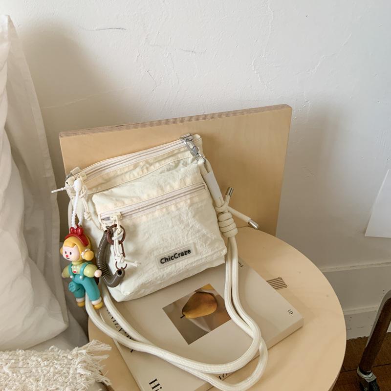 Shoulder bag women's solid color couple outdoor summer new lightweight messenger bag men's and girls outdoor sports small satchel