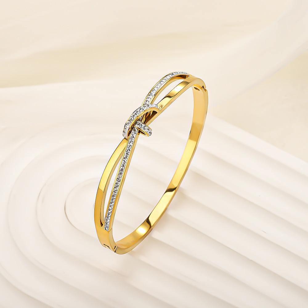 Classic titanium steel bracelet, stainless steel plated18k Gold bracelet with a simple and luxurious design, full of diamonds, featuring a bow and