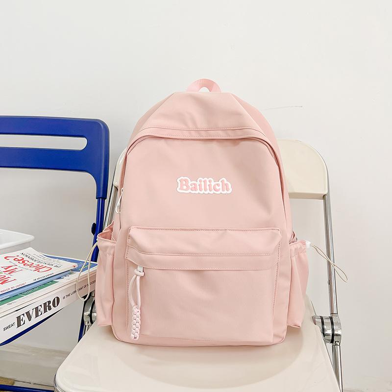 

New junior high school student backpack schoolbag simple backpack women s leisure bag high-end sense large capacity розовый