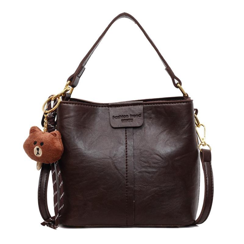 Neue trendige Mode mit Anhänger Schulter Damenhandtasche Retro Schulter Große Kapazität Breitband Umhänge Eimerhandtasche