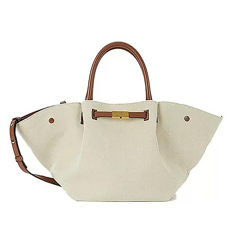 

Demellier wing bag leather shoulder portable tote bag premium sense women s bag large capacity commuter dumpling bag