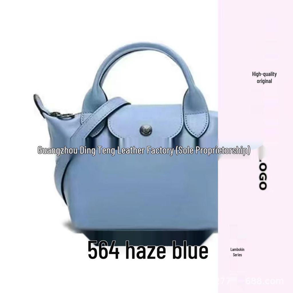 Hochwertige Mini-Knödeltasche aus Nappaleder mit Drachenprägung, Vielseitig für den Weg zur Arbeit, zum Tragen in der Hand, über der Schulter, mit verstellbarem Crossbody-Riemen.