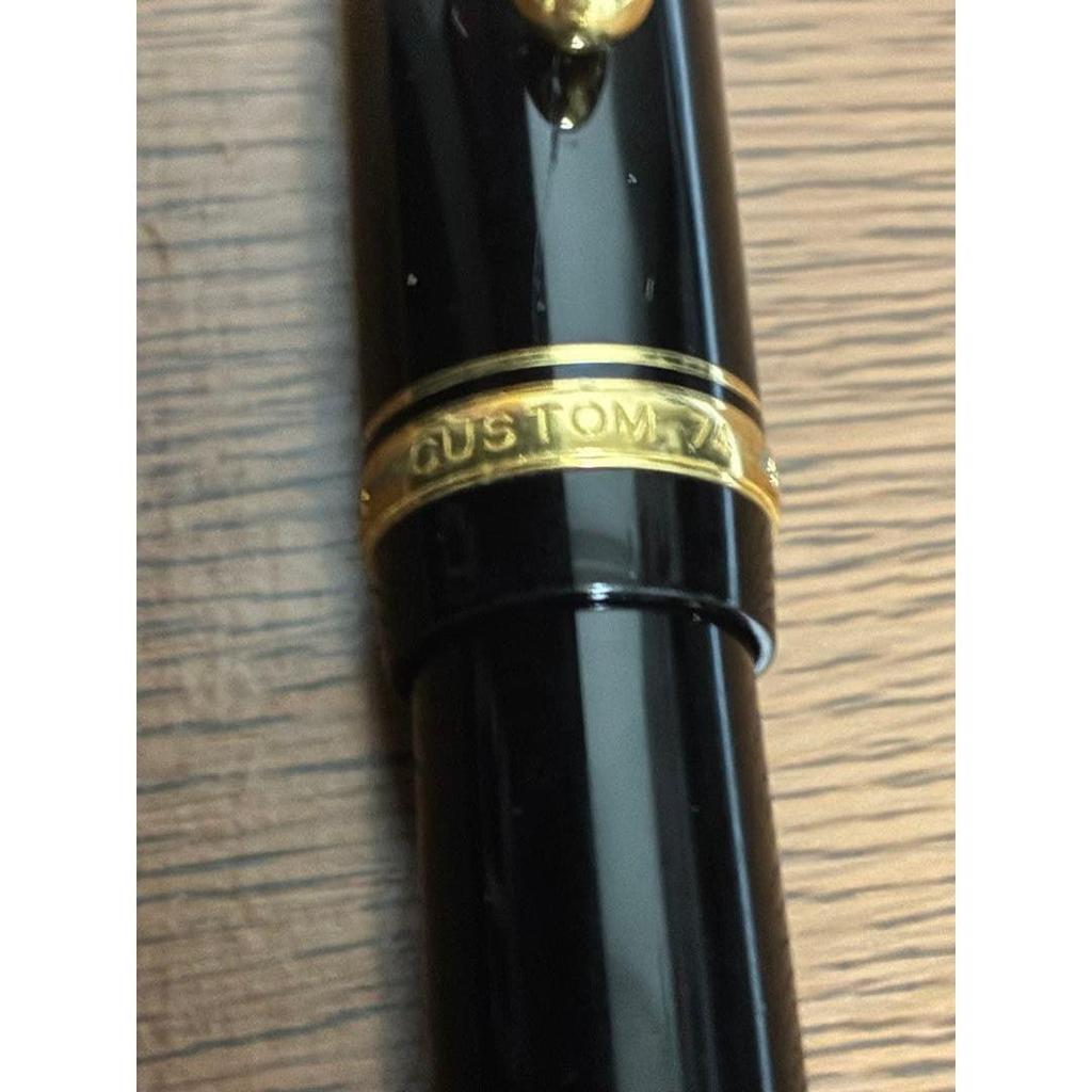 Used PILOT ballpoint pen, black, gold clip