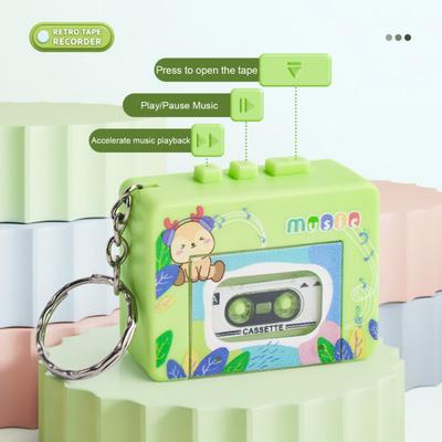 Zabawka w postaci magnetofonu kasetowego w stylu retro, 10 piosenek, funkcja odtwarzania/pauzy, przegroda na taśmę, brelok do kluczy, ozdoba, zabawny wisiorek do zmiany głosu dla dzieci