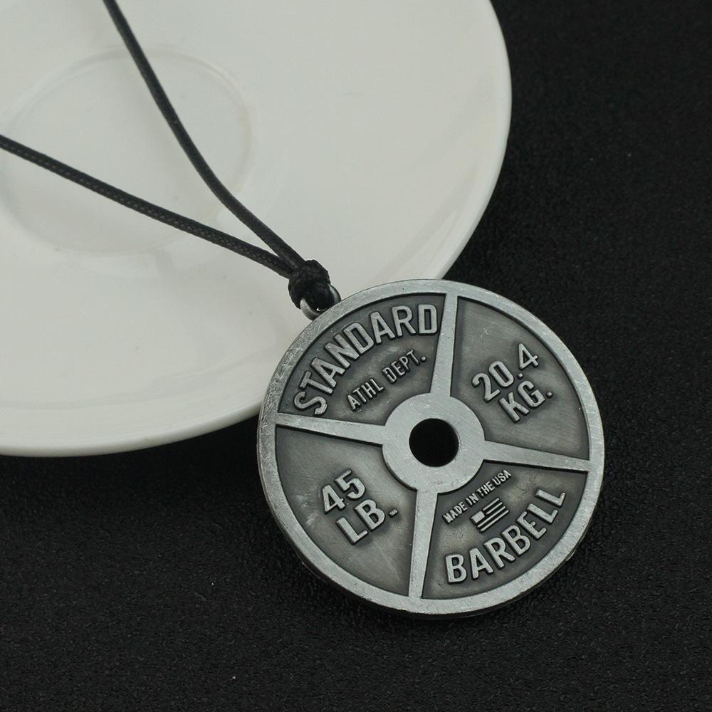 

A retro punk-style weightlifting barbell and dumbbell pendant necklace, a fashionable and trendy men s fitness and sports jewelry gift.