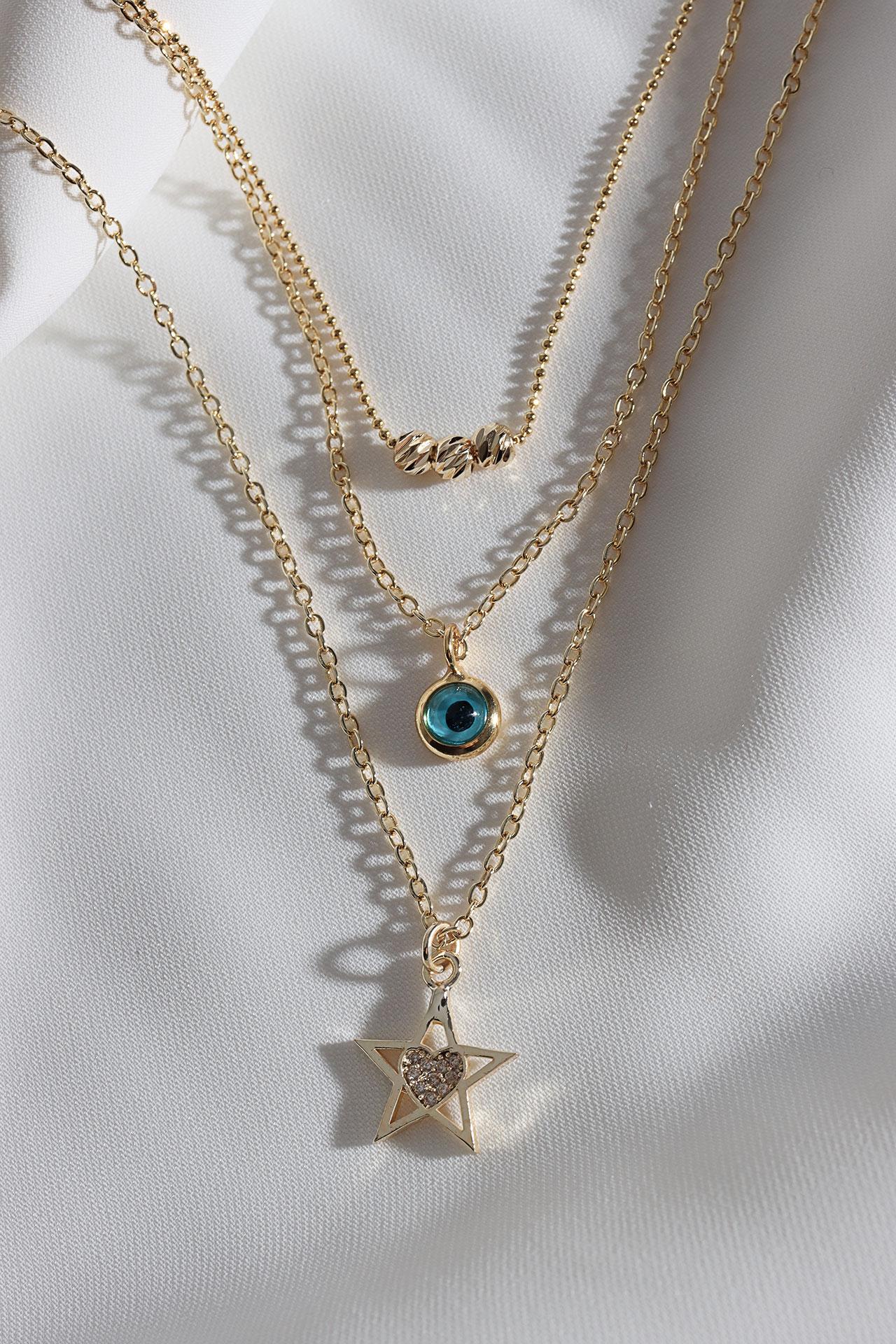 

Ожерелье золотого цвета с 3 звездами и подвесками от сглаза