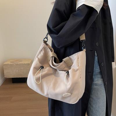Bolso cruzado de hombro para mujer 2025 nuevo de gran capacidad para estudiante bolso de mano de clase lienzo de color liso moderno y simple