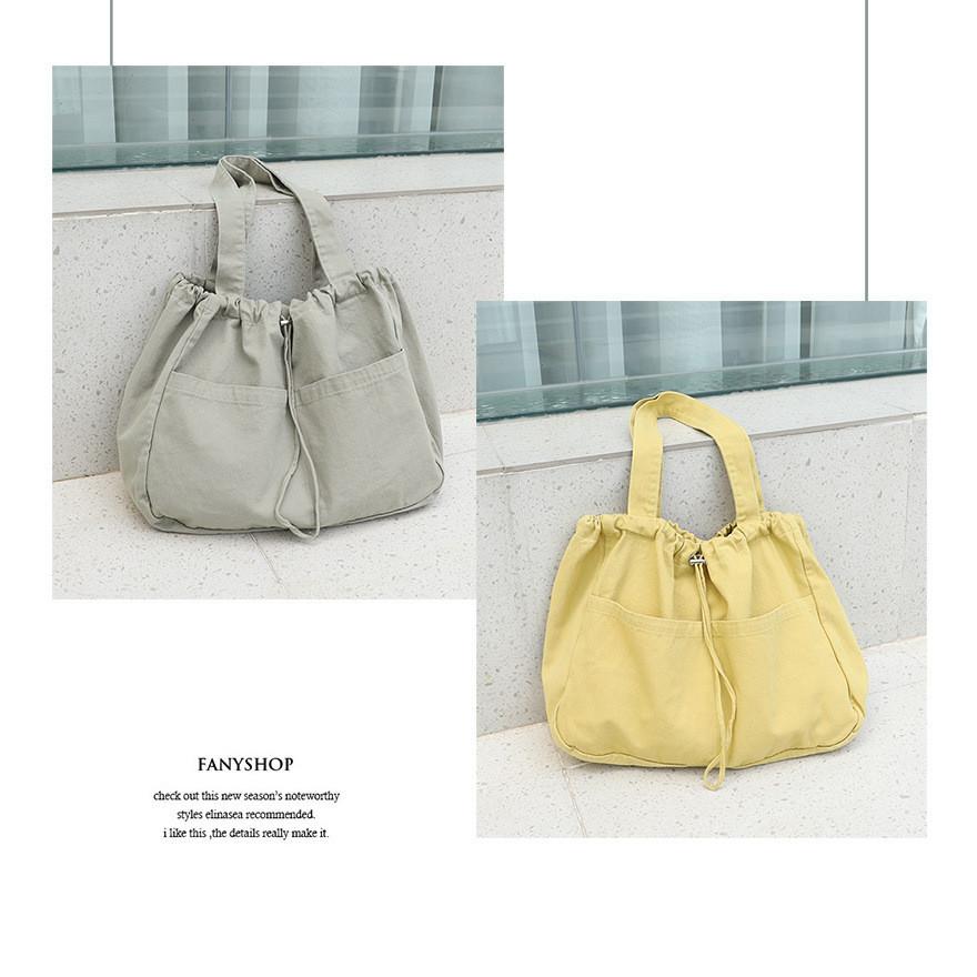 IELGY Japanese casual drawstring bundle handbag, retro washed canvas fashionable solid color shoulder women's bag
