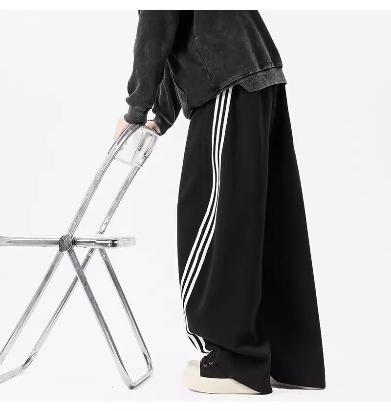 Pánské tmavě modré široké tepláky se třemi pruhy - Ležérní jarní high street trend