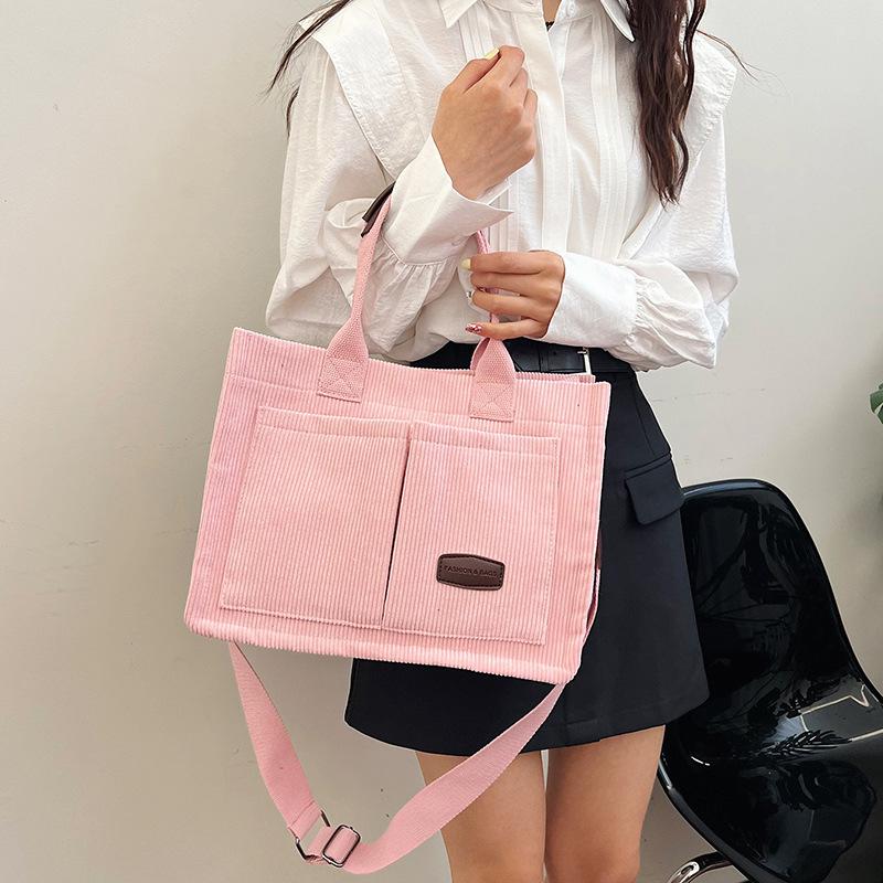 2025 new large-capacity commuter portable tote bag women's versatile strip velvet shoulder bag trendy wide shoulder strap messenger bag bag