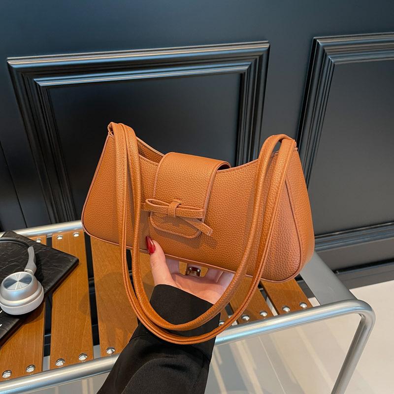 Korean version of premium bow underarm women's bag 2025 summer trendy simple casual baguette bag shoulder handbag