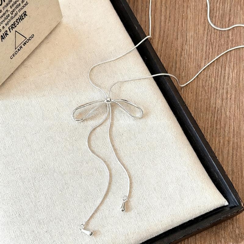 

New Copper Color Long Rope Women s Necklaces Hollow Movable Bowknot Bohemian Fashion Neck Zircon Winter Sweater Chain 2026