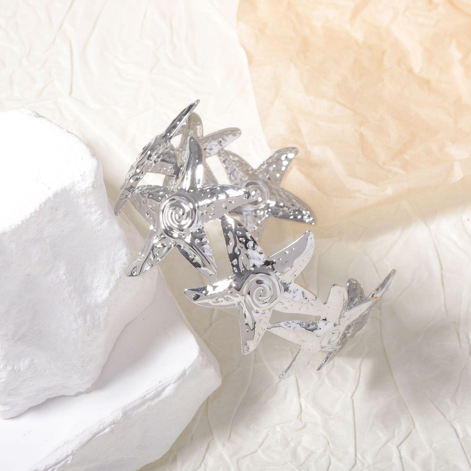 

European and American unique and niche design sense metal starfish open women s bracelet, casual vacation style