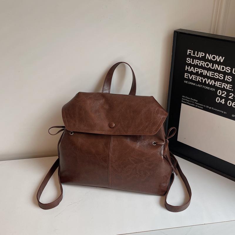 

Британский ретро рюкзак высокого качества женский 2025 лето новая модная сумка большая вместимость рюкзак темно-коричневого