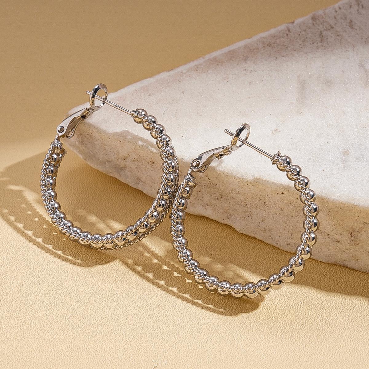 

Metal geometric hollow round silver needle earrings fashion temperament earrings