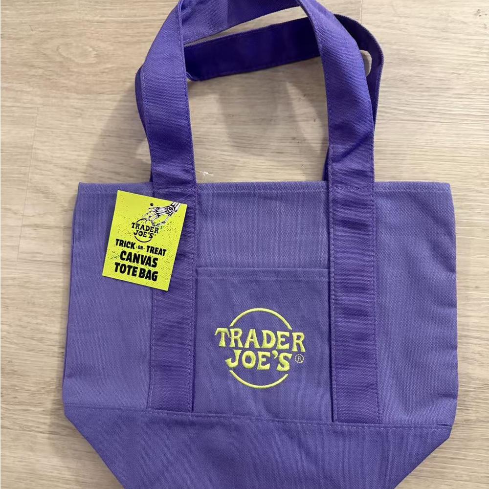 Official Trader Joe's Trick or Treat Tote Bag - Purple Reusable Canvas Bag for Groceries Cycling Errands Cafe Outings