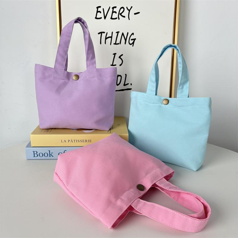 Effenkleurige eenvoudige lunchtas, draagbare canvas tas, kleine stoffen tas, draagbare canvas tas voor het opbergen van diverse spullen