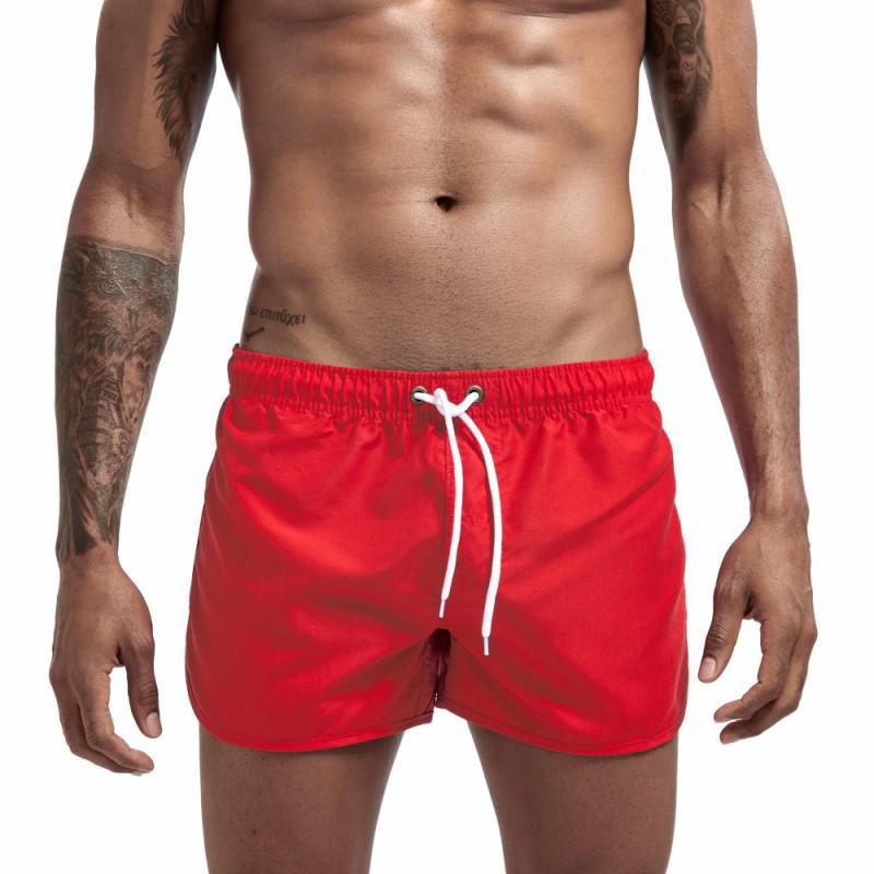 

2026 Men s European and American Solid Color Beach Shorts - Fashionable, Loose Fit Sports Shorts with Drawstring. S красный