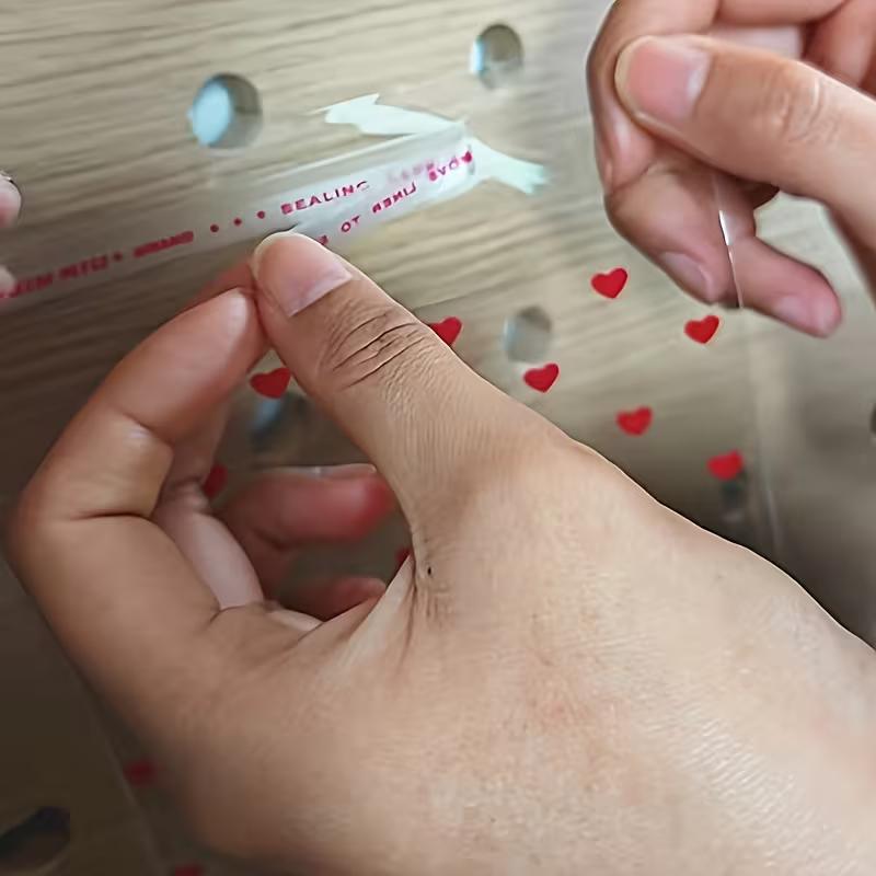 WTEMPO Valentinstag Hochzeit Geschenkbeutel Herzförmiges Muster Aufgedruckt Klare Selbstversiegelnde Beutel Tragbare Wiederverwendbare Plastiktüten Universelle Verpackungsbeutel