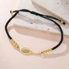 Gioiello Sportivo Minimalista in Acciaio Inossidabile con Intaglio Racchetta e Cordino Intrecciato Personalizzabile