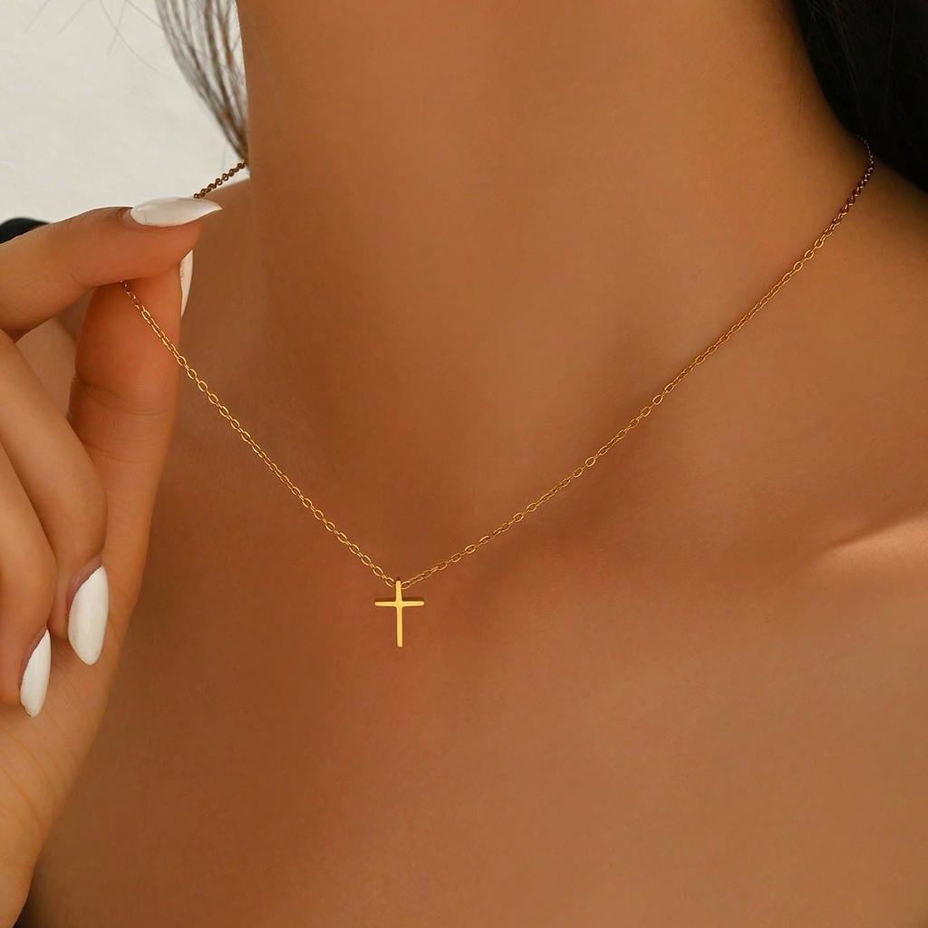 A Delicate And Compact Golden Cross Necklace, an Artistic And Versatile Piece That Highlights The Elegance of The Neck And Unique Taste
