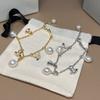 Meier Queen mother's baroque pearl saturn bracelet