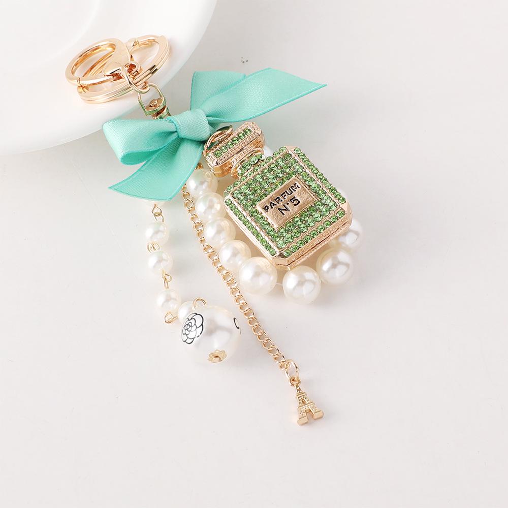 Korean-Style Handmade Rhinestone Perfume Bottle Keychain with Bow and Pearl Charm
