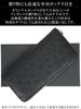 This black ostrich wallet for women features a genuine ostrich quill mark and is made from a single piece of genuine It features a round zipper a coin