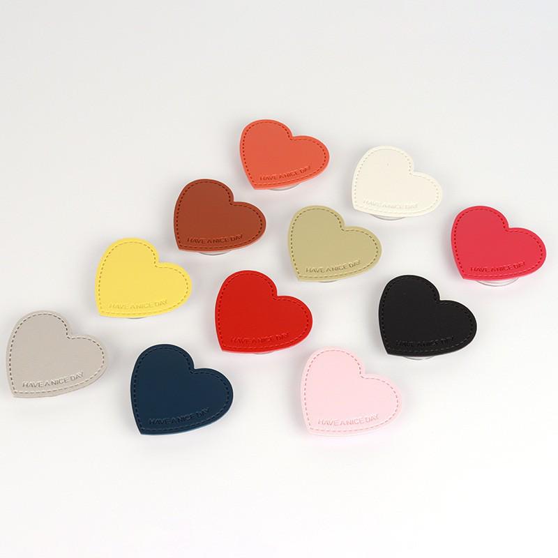 Leather Heart-Shaped Phone Holder: Retractable, Adhesive Stand for Easy Viewing