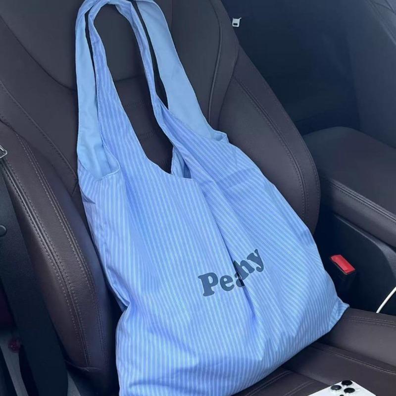 

New Korean striped large-capacity letter simple and versatile printed cloth bag niche design commuter shoulder bag синій