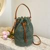 2025 New Niche Hollow Holiday Wind Drawstring Woven Bag Casual Small Fresh Light Portable Messenger Bag Women