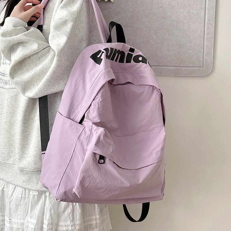 Lightweight Minimalist Backpack for Female Students: Versatile Double-Shoulder Bag for School and Travel.
