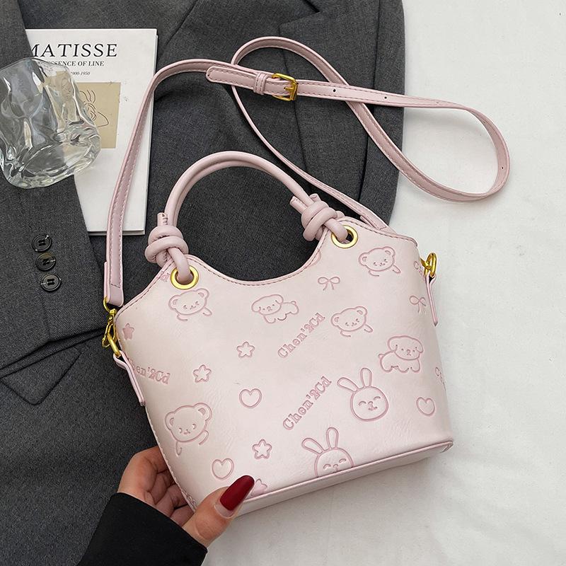 2025 new niche embossed fashion personalized portable bucket bag high-end commuter versatile women's messenger bag