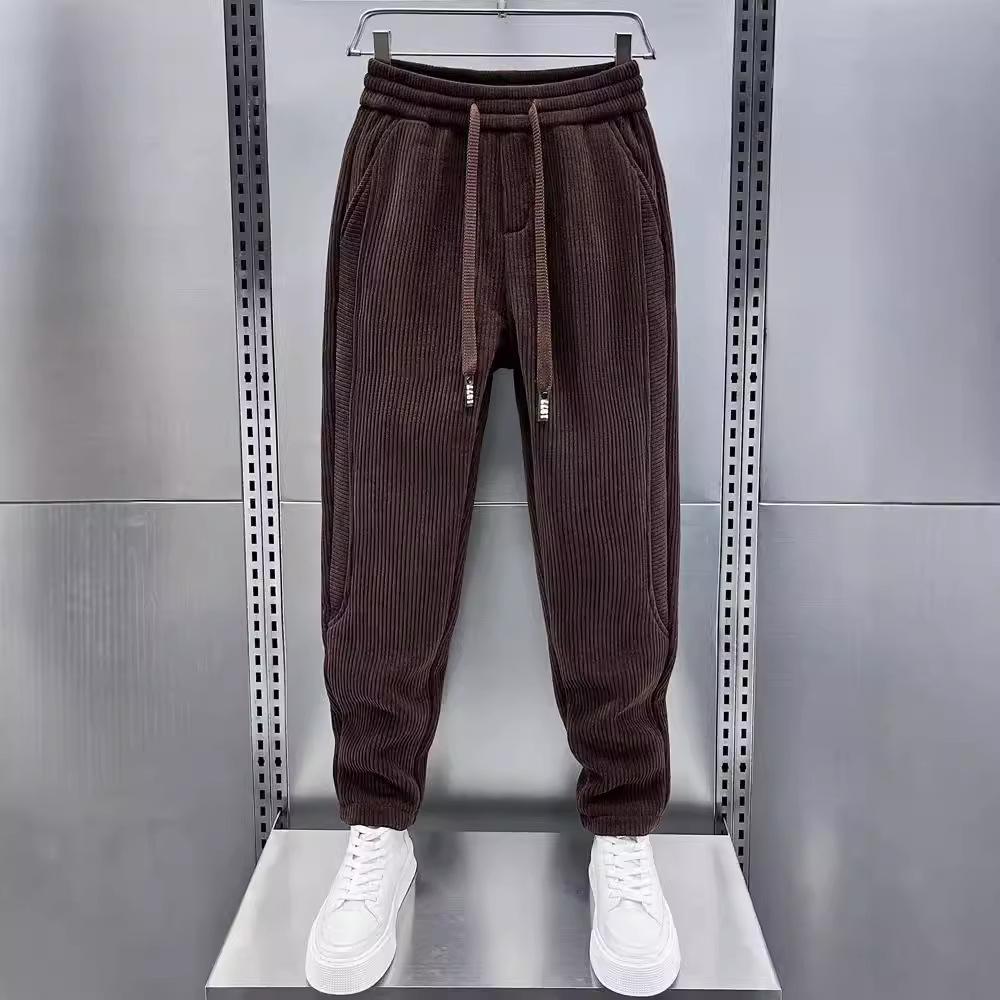 

Весна 2024 г. Мужские повседневные корейские вельветовые спортивные брюки - свободный крой с зауженными штанинами 3XL коричневый