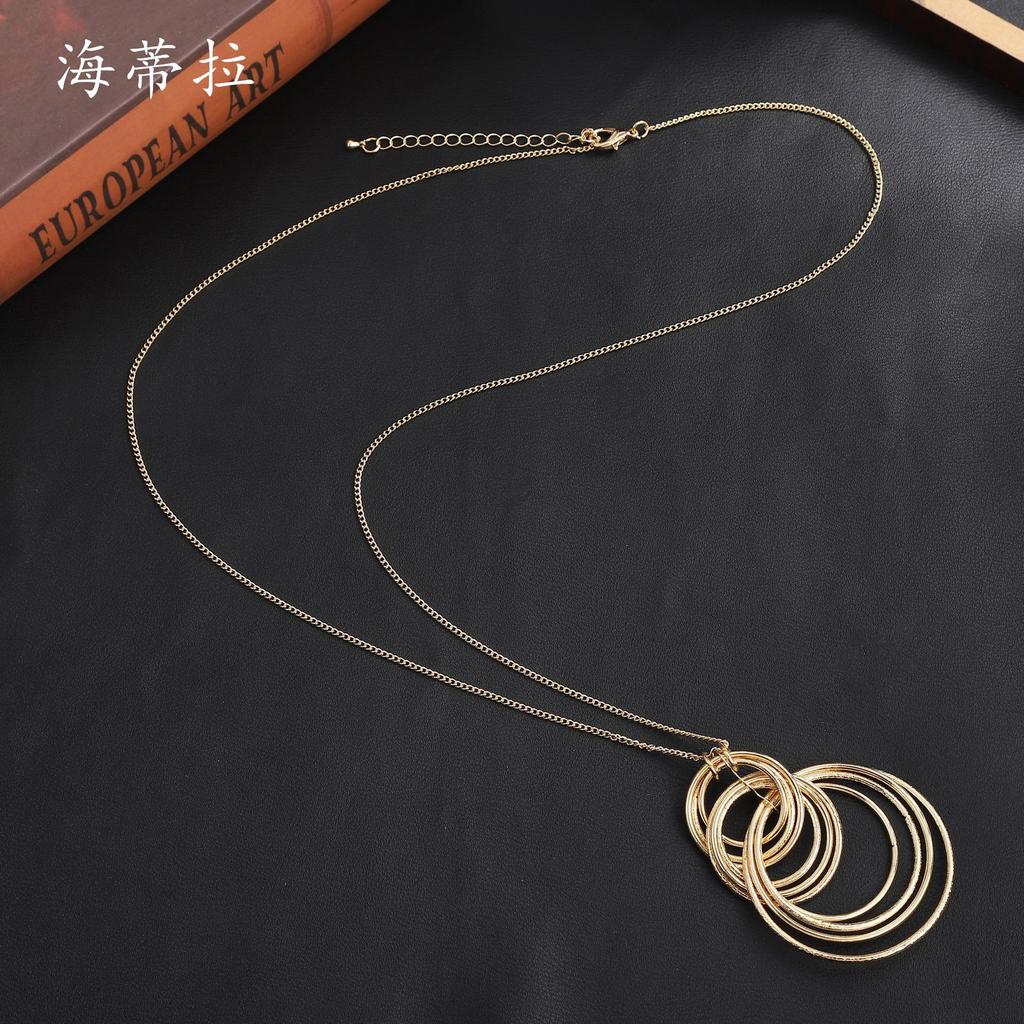 New Geometric Ring Stacked Long Sweater Chain, Fashionable and High-end Women's Versatile Ring Long Pendant