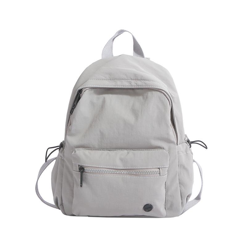 Casual backpack niche cute student bag versatile travel new sports lightweight backpack