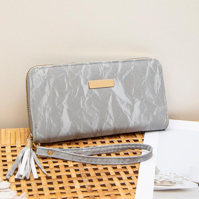 Spring and summer new simple multi-card position hand-held women's bag, fringed zipper, long wallet, and a wallet.