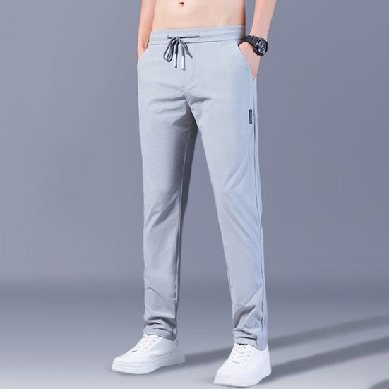 Men Pants Solid Color Drawstring Mid Waist Pockets Loose Streetwear Straight Working Trousers for Daily Wear