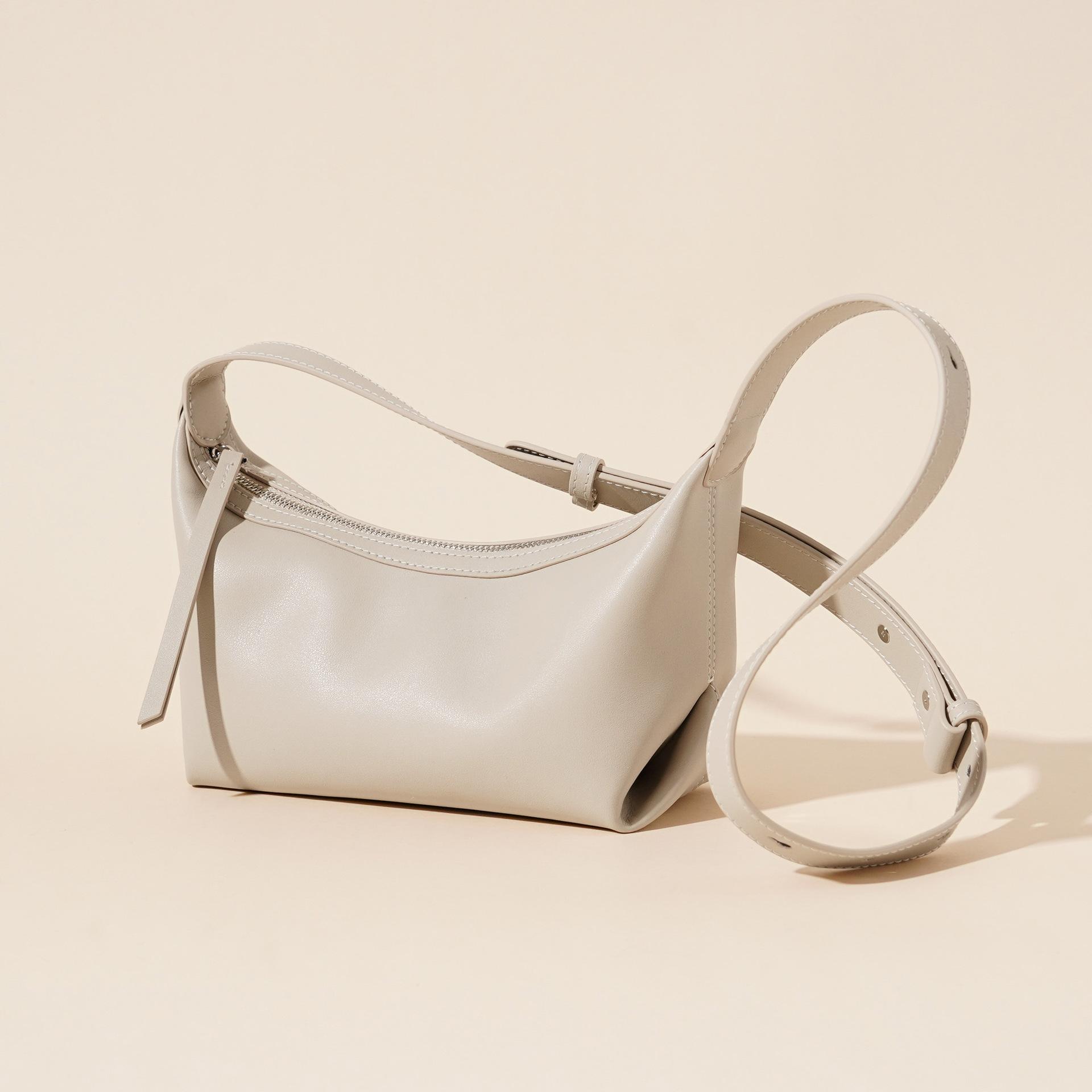 

Новая сумка-пельмень из коровьей кожи, нишевый дизайн, модная, универсальная кожаная сумка подмышку, высококачественная кожаная сумка через плечо 24.5*11*14.5cm кремовый