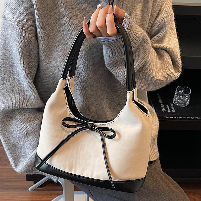 Korean version of niche foreign style portable bucket bag women's 2025 autumn new high-value suede bow shoulder bag