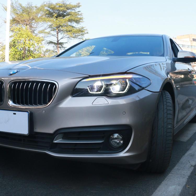 LED Daytime Running Lights & Ozum Laser Bi-Xenon Lens Headlight Assembly for 2011-2017 BMW 5 Series.