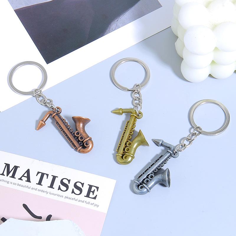 Mini nástroj Saxofon Přívěsek na klíče do auta Mini hudební nástroj Kovový kroužek na klíče Příslušenství Přívěsek na tašku Dárky na hudební festival