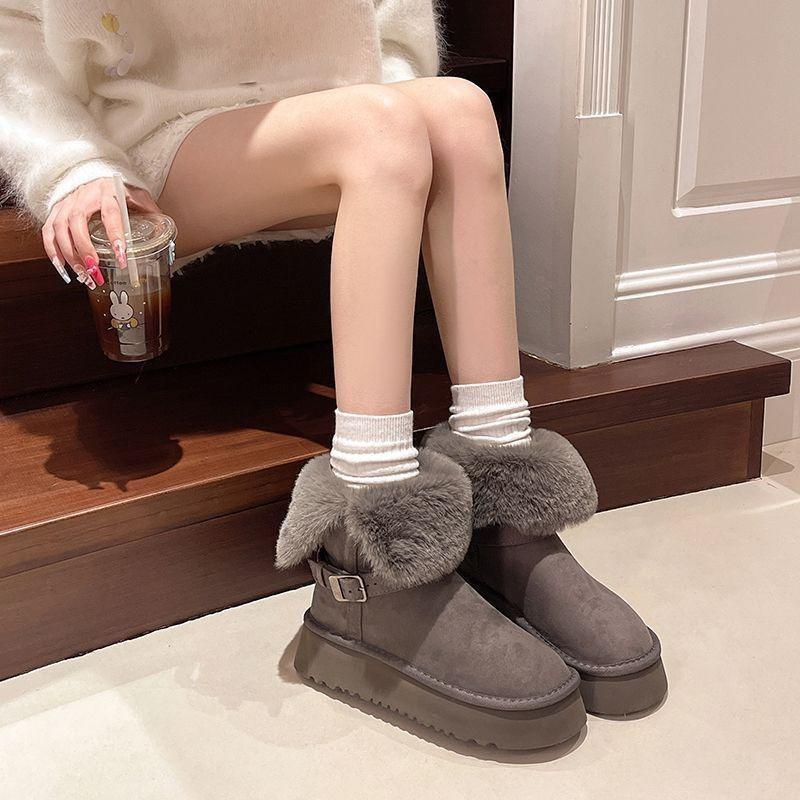 Two women wearing snow boots, and women wearing thick-soled piled and thickened short cotton shoes in winter