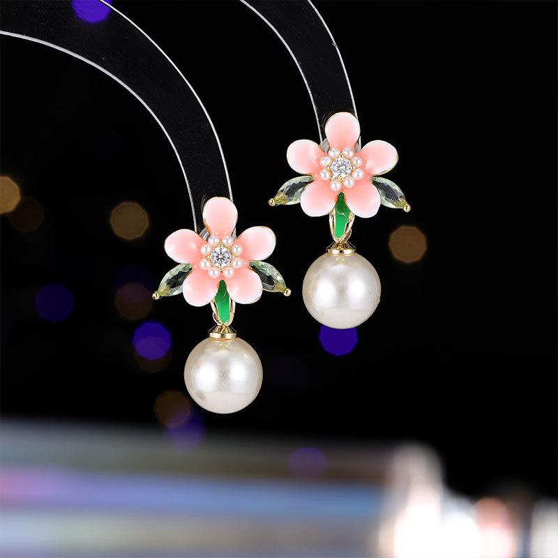 

Ladies Light Luxury Design Cherry Blossom Drip Oil Imitation Pearl Earrings Fashionable And Versatile Niche Design Earrings