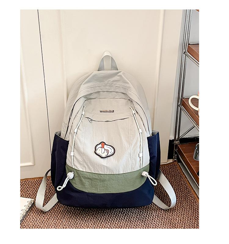 Simple schoolbag, Korean contrasting colors, new schoolbag, light travel and leisure backpack, high value, dirt-resistant