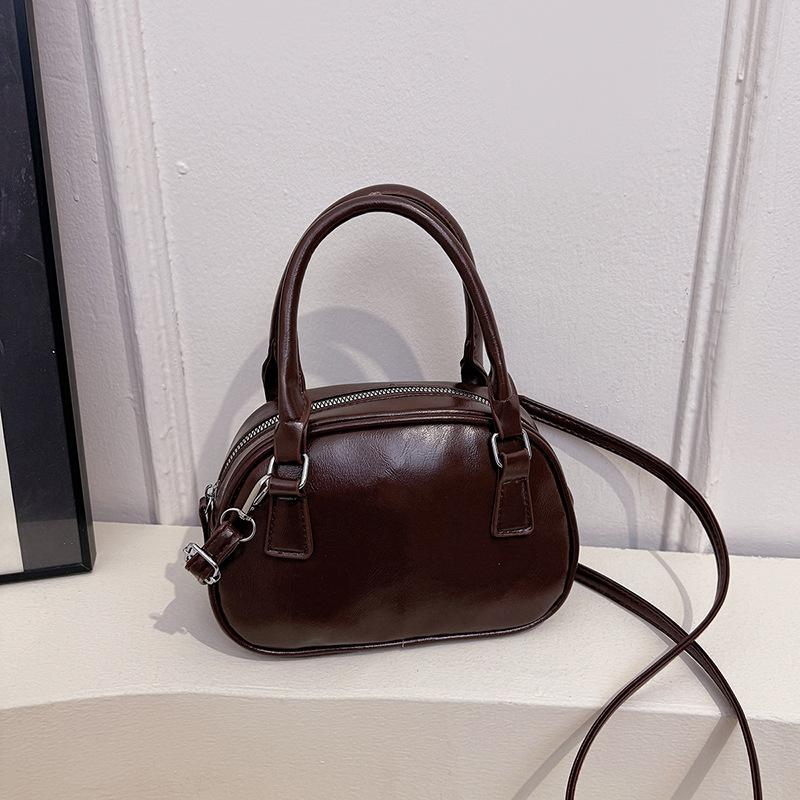 Neue Nischendesign modische Textur Handtasche Bowlingtasche Damen vielseitige Schulter Umhängetasche